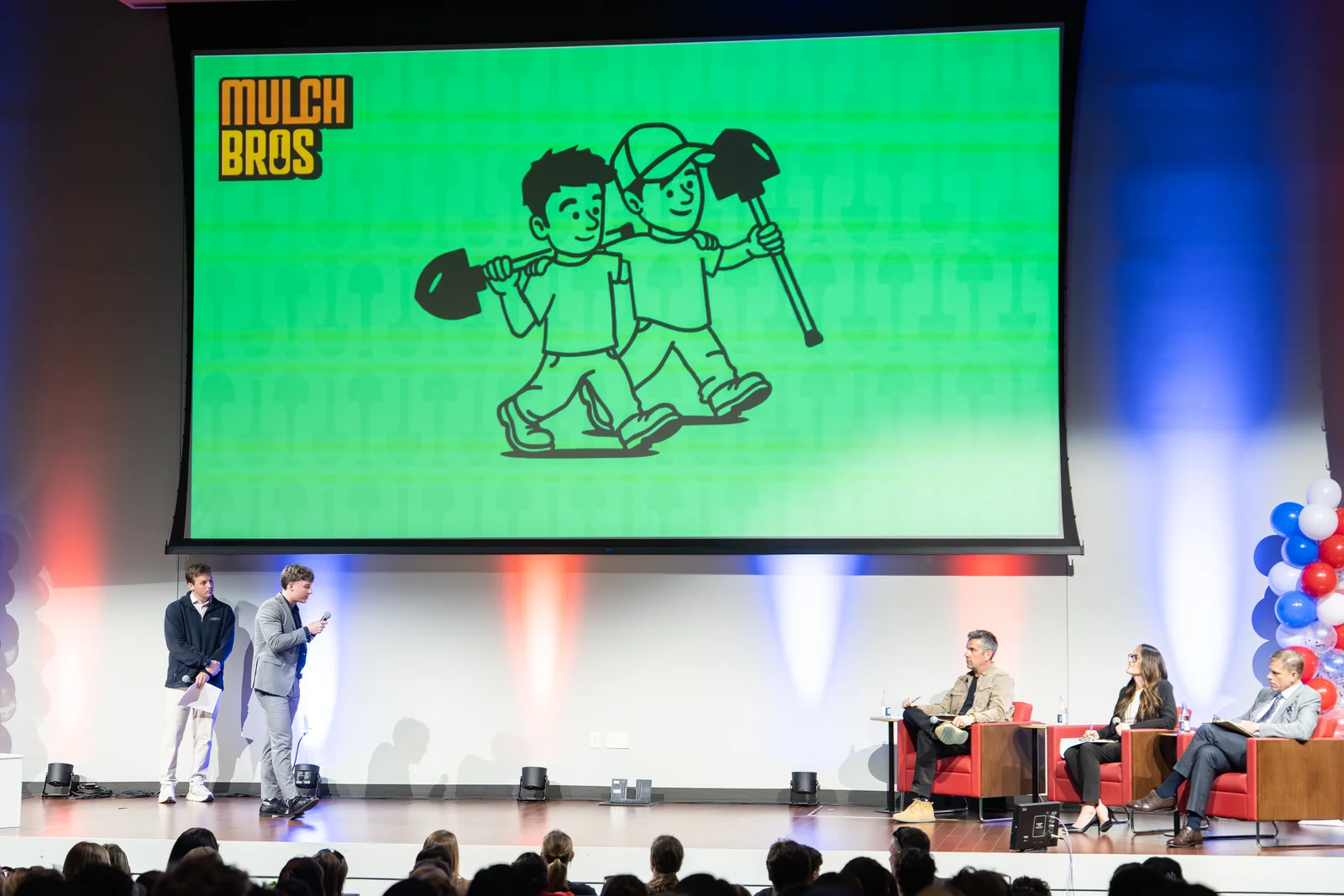 Mulch Bros founders pitching on stage at the Spark Tank entrepreneurship competition