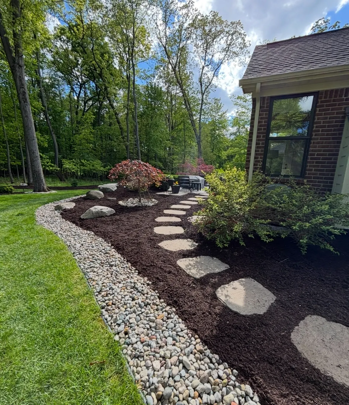 Stepping stones in mulch bed in Milford, MI