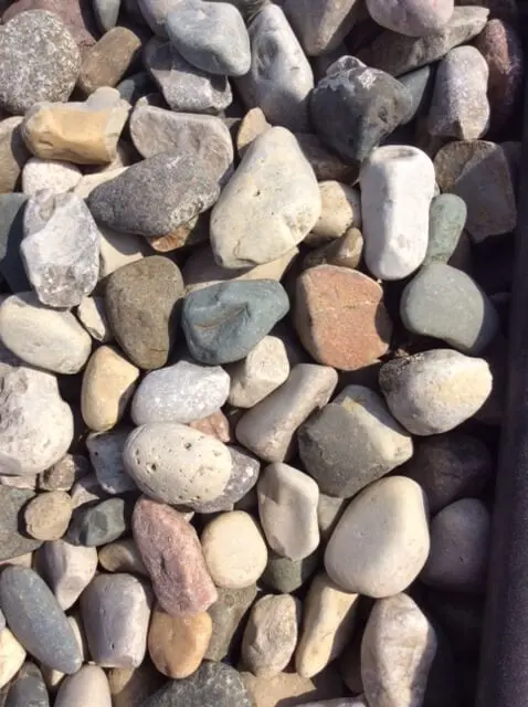 Smooth, rounded river rock in mixed natural colors
